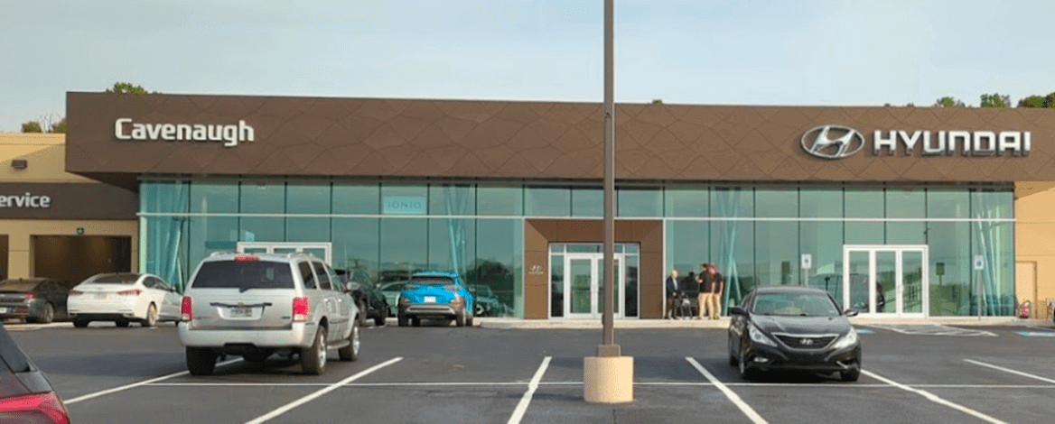 Car dealership exterior with parked vehicles