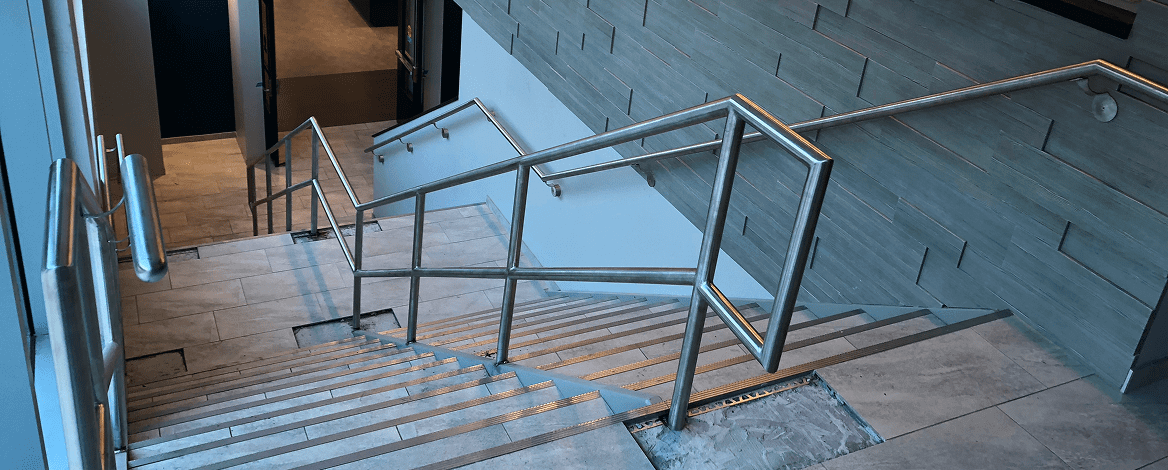 Indoor staircase with metal railings